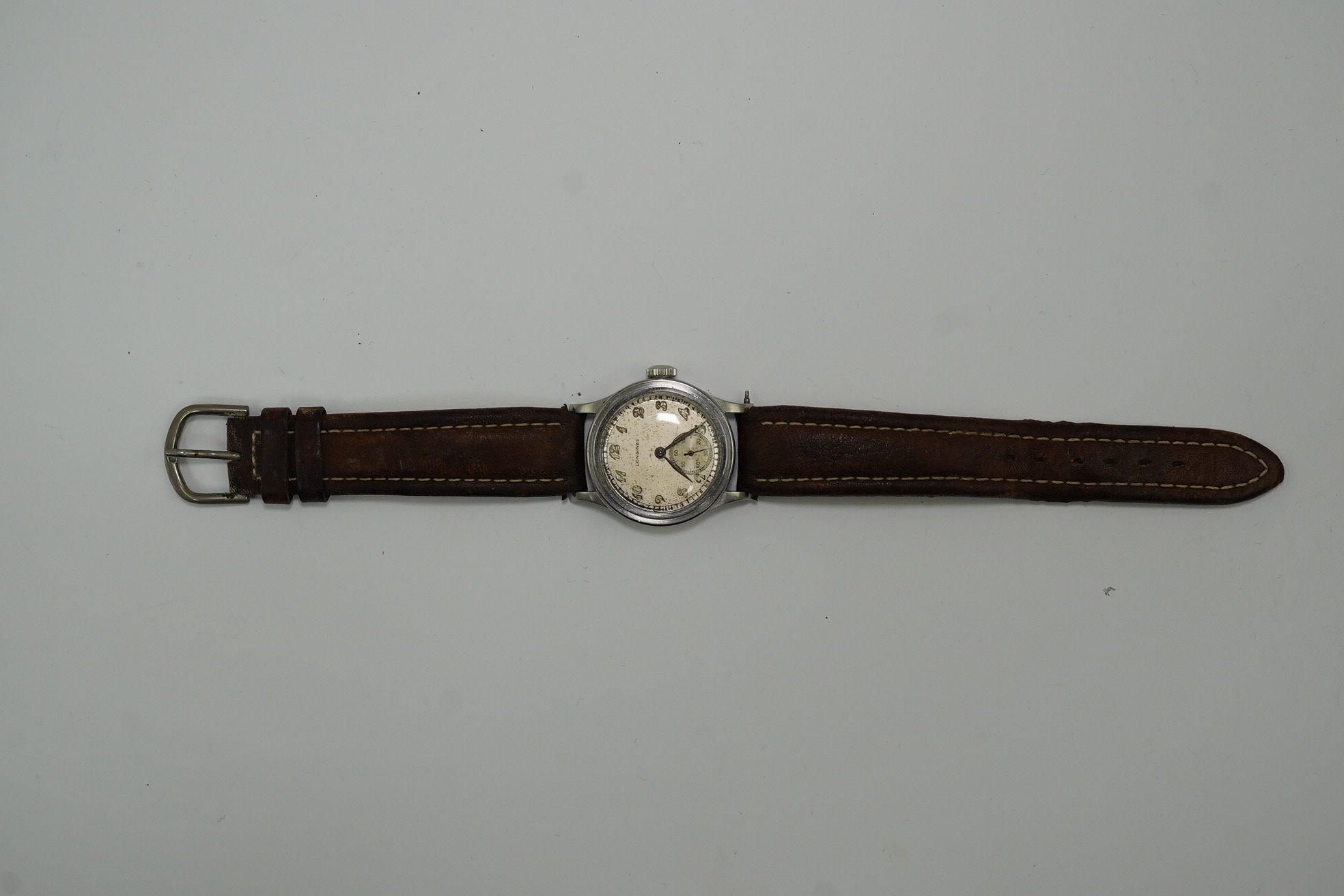 A gentleman's mid 1940's steel Longines military manual wind wrist watch